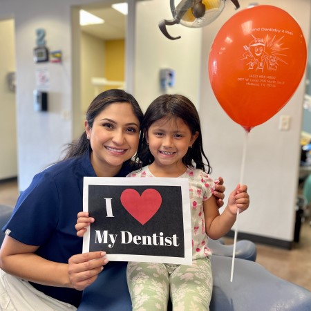 Dentist & Patient Holding Baloon